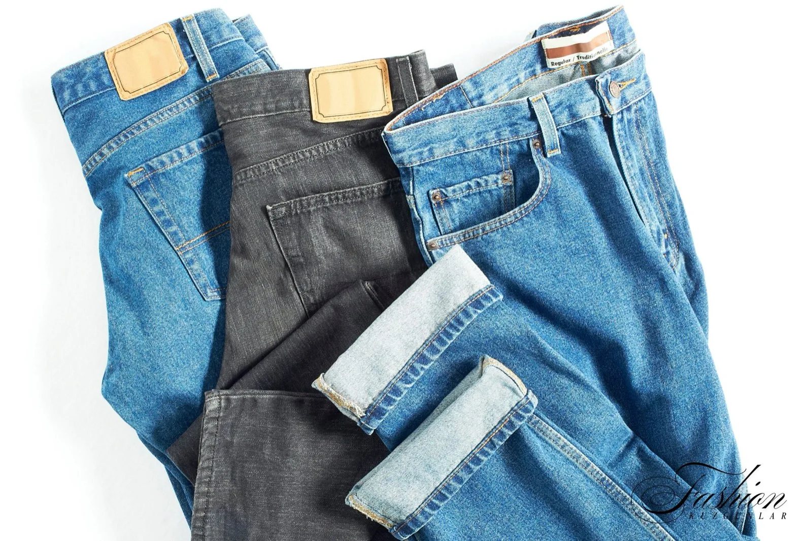 Folded jeans in light blue, black and mid-blue washes