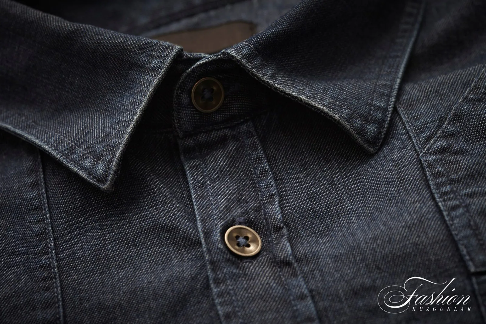 Collar and buttons of a dark denim shirt