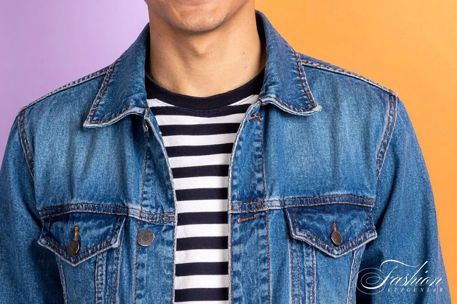Man in a classic blue denim jacket over a striped T-shirt